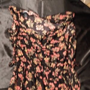 Adorable Sleeveless, flower print jumpsuit.